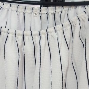 Black stripped white shirt.